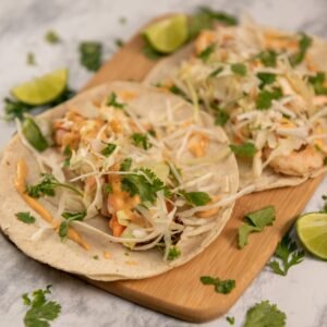 Authentic shrimp tacos with lime and cilantro garnish, perfect for a tasty Mexican dish.